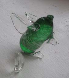 green glass pigasus with broken-off wing