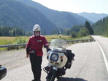 John beside bike beside road