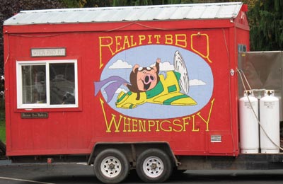 "Real Pit BBQ - When Pigs Fly" (red vending trailor)